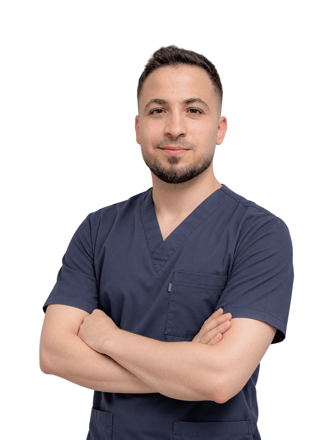 Dr. Muhammed Enes Al-Kawakibi, founder of Aflak, in dark scrubs with his arms crossed